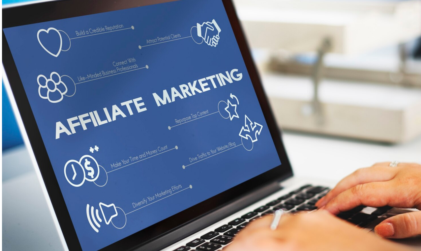 The businesswoman is using the laptop for affiliate marketing